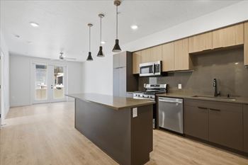 Modern kitchen with a wooden island and stainless steel appliances
